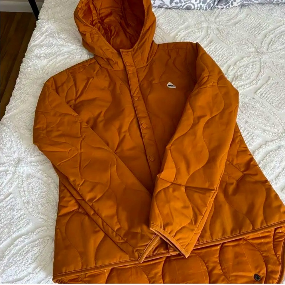 Women's Hooded Jacket
Attached hood; Snap-closure hand-warmer pockets